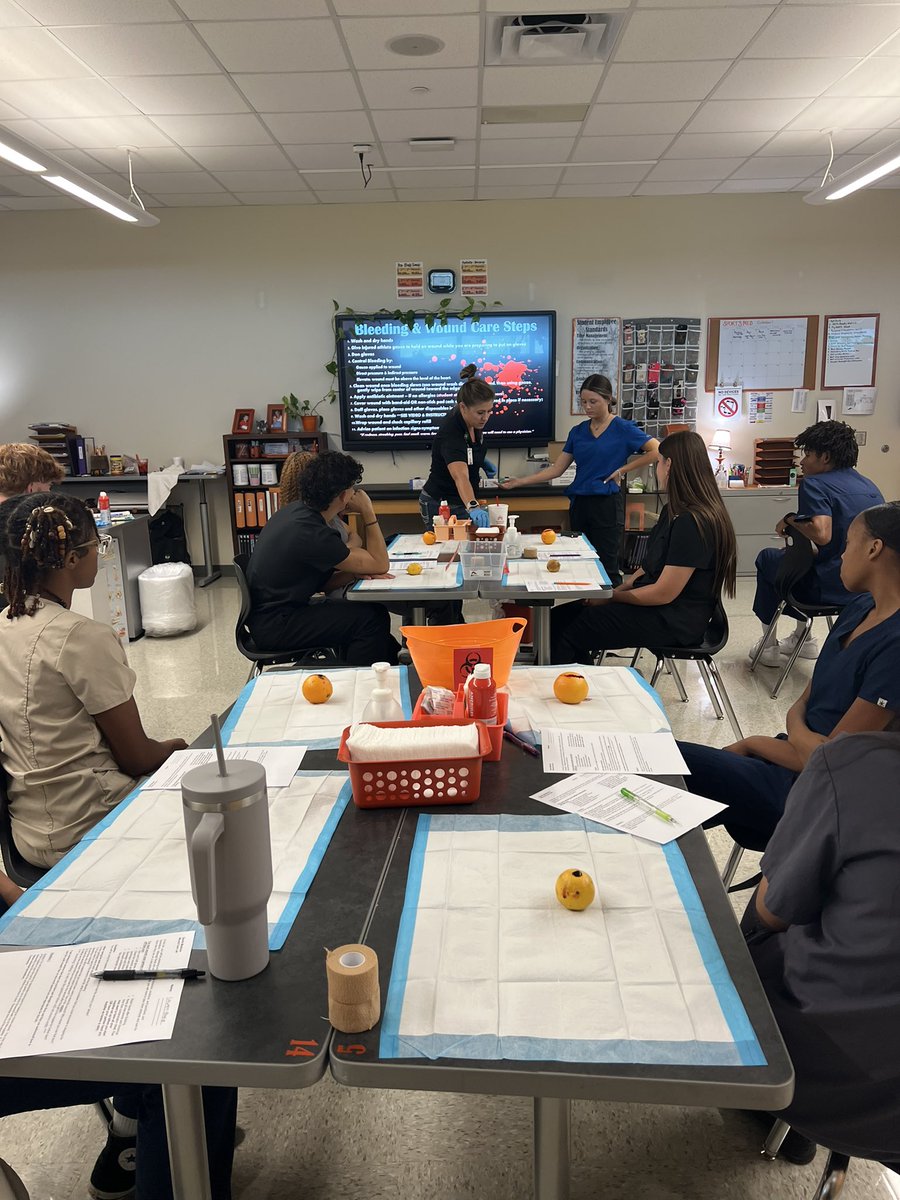 JRittmueller's tweet photo. Oranges today, athletes tomorrow! 🍊 Our sports medicine students mastering wound care techniques. Kudos to our creative teachers for this zestful approach to wound care practice! #FutureMedics #PracticeMakesPerfect #HCTCReady @CtcHollenstein @EMSISD @EMSISD_CTE https://t.co/OM4hBz5n4x