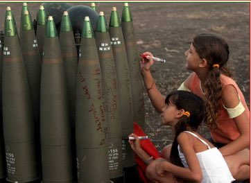taraalami's tweet photo. In 2006, these children were writing “from israel with love” and drawing hearts on missiles the zionist regime used on Beirut during the 2006 zionist war on Lebanon, which killed at least 2000 Lebanese people displaced over 500,000 in 34 days https://t.co/v6w81QBbUf