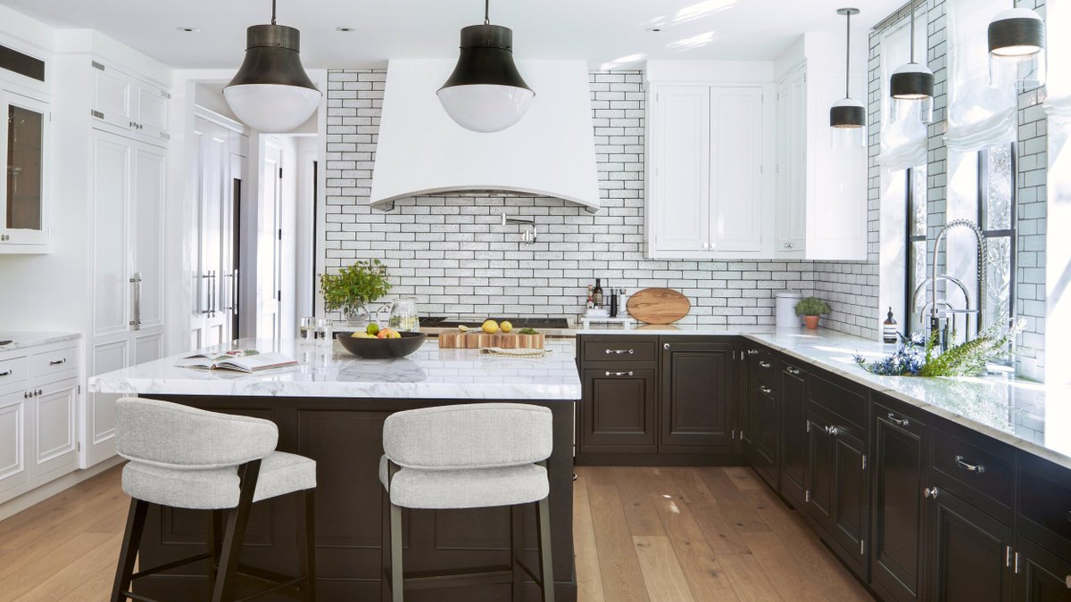 Explore the essence of well-being woven into this chic kitchen crafted by Colorado's Joe McGuire Design! The timeless black and white color scheme fosters harmony, while the elegant island and cabinetry combine functionality with sophistication.

rb.gy/1og4o