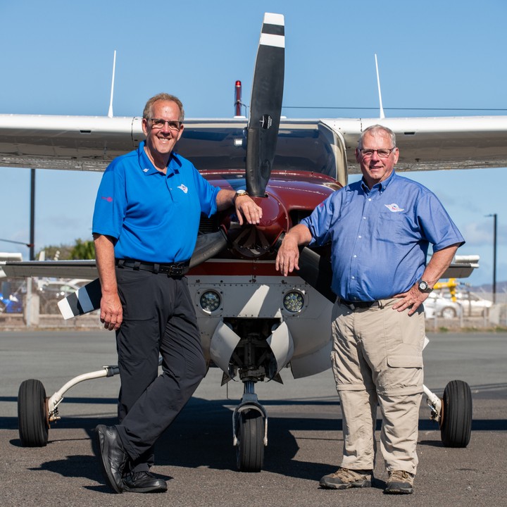 Peter Teahen and John Ockenfels standing in front of their plane