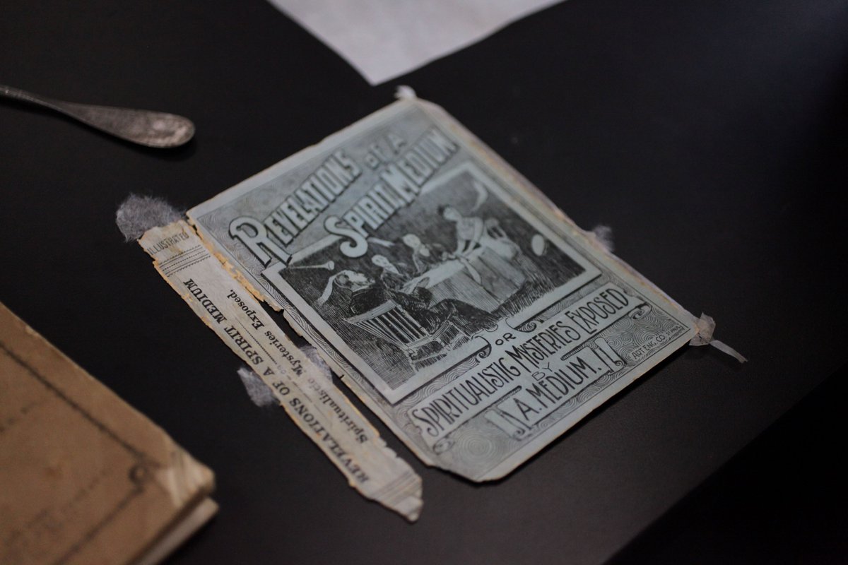 NEDCCInfo's tweet photo. Happy Friday the 13th! A harrowing copy of "Revelations of a Spirit Medium" from the Phillips Library of the Peabody Essex Museum recently came through the lab. Assistant #BookConservator Amelia Sorensen performed a magical treatment of mending tears and filling losses. https://t.co/wfyiP0IgDO