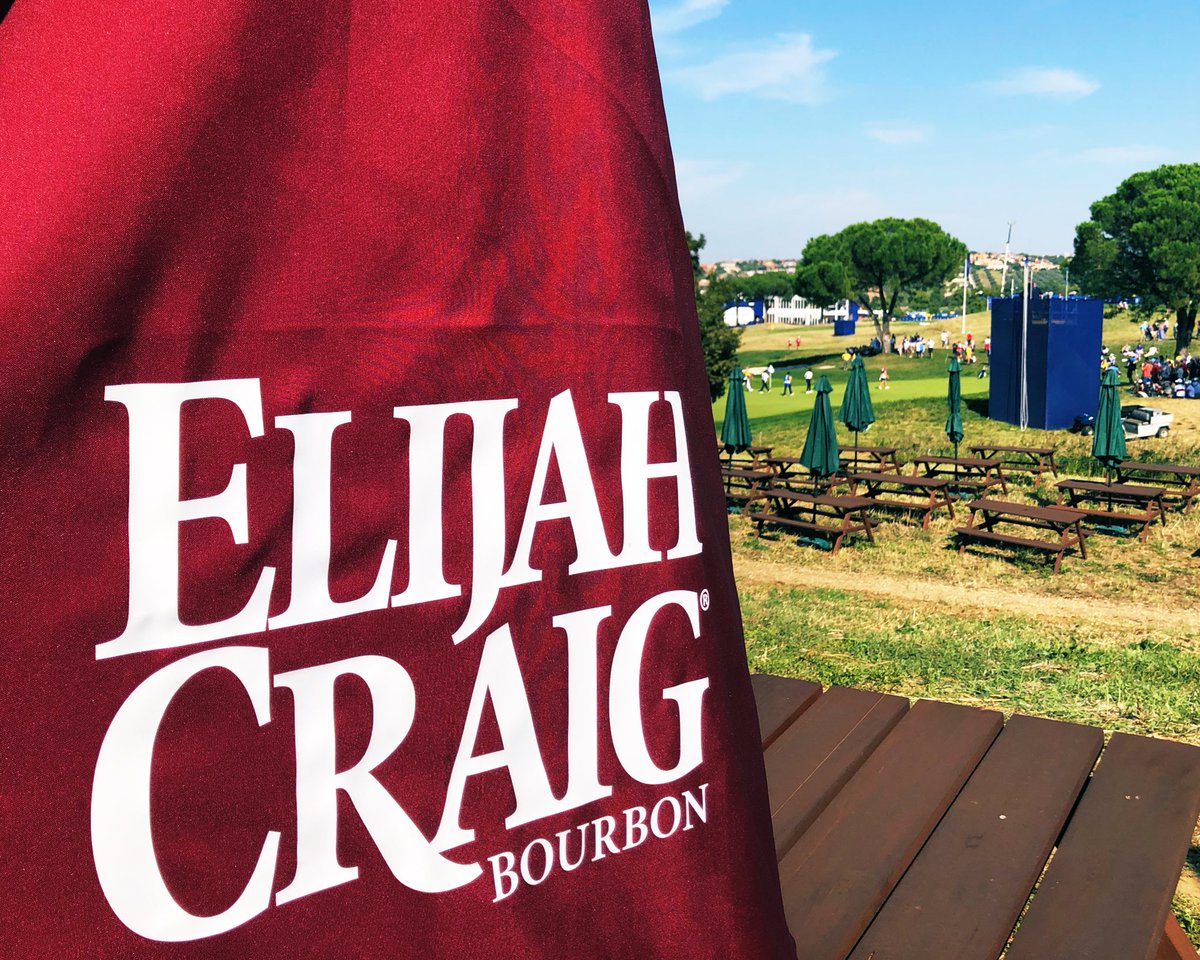 RDole3's tweet photo. @Elijah_Craig @rydercup 10th green at Marco Simone in the background. By Sunday, those umbrellas were all down by the camera tower! 🤣🥃 https://t.co/X6jWg513hN