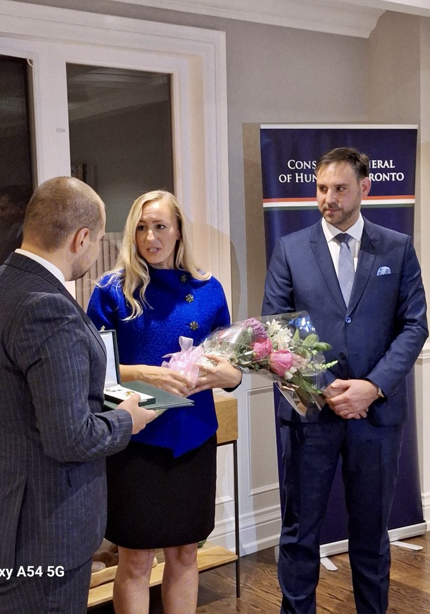 Hungary_Toronto's tweet photo. H.E. Katalin Novák, Hungary's President, awarded Min. Kinga Surma with the Order of Merit Officer's Cross. Valér Palkovits Dep. Dir. of Dip. Aff. at the Sándor Palace presented the honor, and Máté Igaz welcomed guests and praised Min. for her support to Ontario's 🇭🇺 communities. https://t.co/9o4LMwhnrK