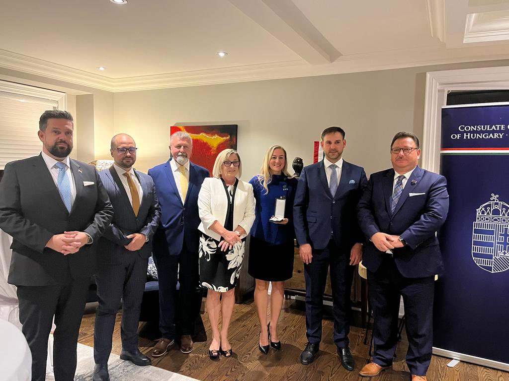 Hungary_Toronto's tweet photo. H.E. Katalin Novák, Hungary's President, awarded Min. Kinga Surma with the Order of Merit Officer's Cross. Valér Palkovits Dep. Dir. of Dip. Aff. at the Sándor Palace presented the honor, and Máté Igaz welcomed guests and praised Min. for her support to Ontario's 🇭🇺 communities. https://t.co/9o4LMwhnrK