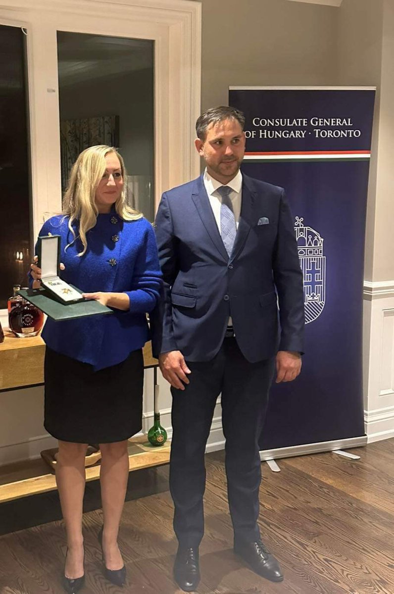 Hungary_Toronto's tweet photo. H.E. Katalin Novák, Hungary's President, awarded Min. Kinga Surma with the Order of Merit Officer's Cross. Valér Palkovits Dep. Dir. of Dip. Aff. at the Sándor Palace presented the honor, and Máté Igaz welcomed guests and praised Min. for her support to Ontario's 🇭🇺 communities. https://t.co/9o4LMwhnrK