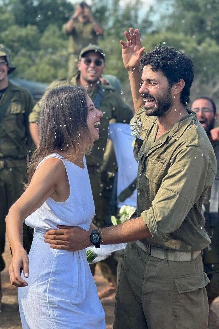 academic_la's tweet photo. Omer and Itai of Emek Hefer had wedding plans for today. But Itai was called up to his unit. His commander suggested they get married in the assembly area with the troops. Omer, who used to serve in the unit, yelled "YES."  Nothing will stop the Jewish people. Ever. https://t.co/uRksSQVKGc