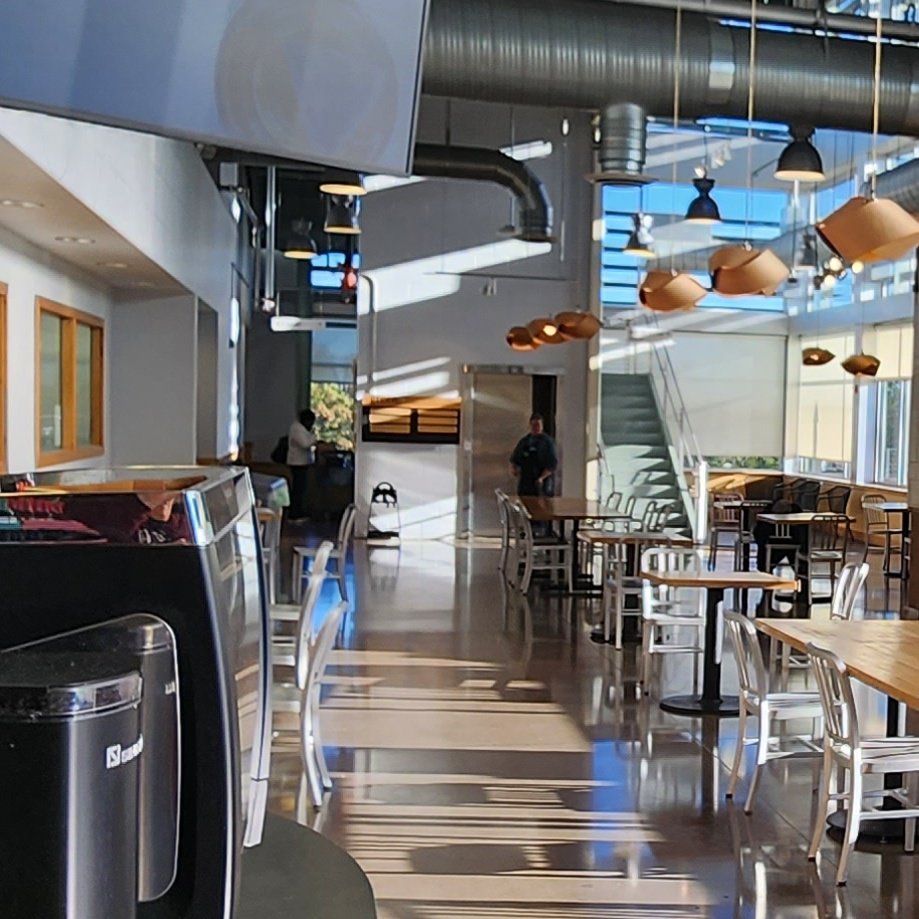 When you come in, we're upstairs. Just go to the back of the seating area and take the elevator or stairs. See you soon.