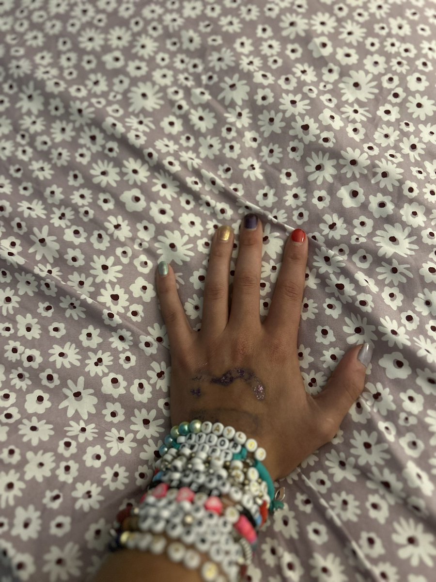 audreybedumb's tweet photo. the 13 is rubbed off but these are the the bracelets i got tonight! <3 #taylorswifterastourmovie 🫶🏼 https://t.co/3VEzZ6Hww2