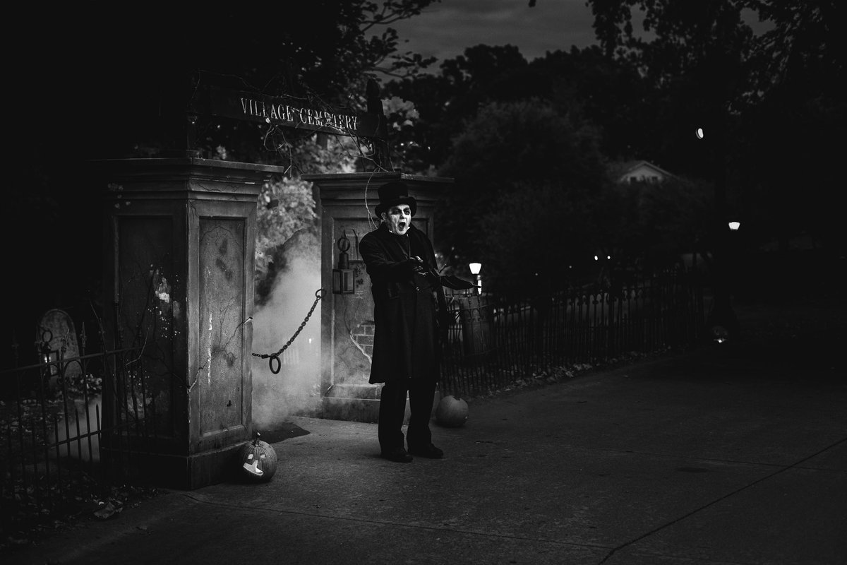 GM to everyone with the Halloween Spirit and to those too scared to get on the Bus. The village cemetery groundsman comes out, points his black umbrella your way, and beckons you to follow. 

"Come, come, the tour is starting, specially designed just for you," he says