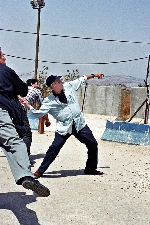 Edward Said (suffering from a fatal cancer) throwing a stone in a symbolic gesture at the Lebanese-Israeli border in July 2000. We spoke a week later after the brouhaha that follow: 'The liberal Zionists are slandering me.' My response: 'Fuck them. Don't be put on the defensive.'