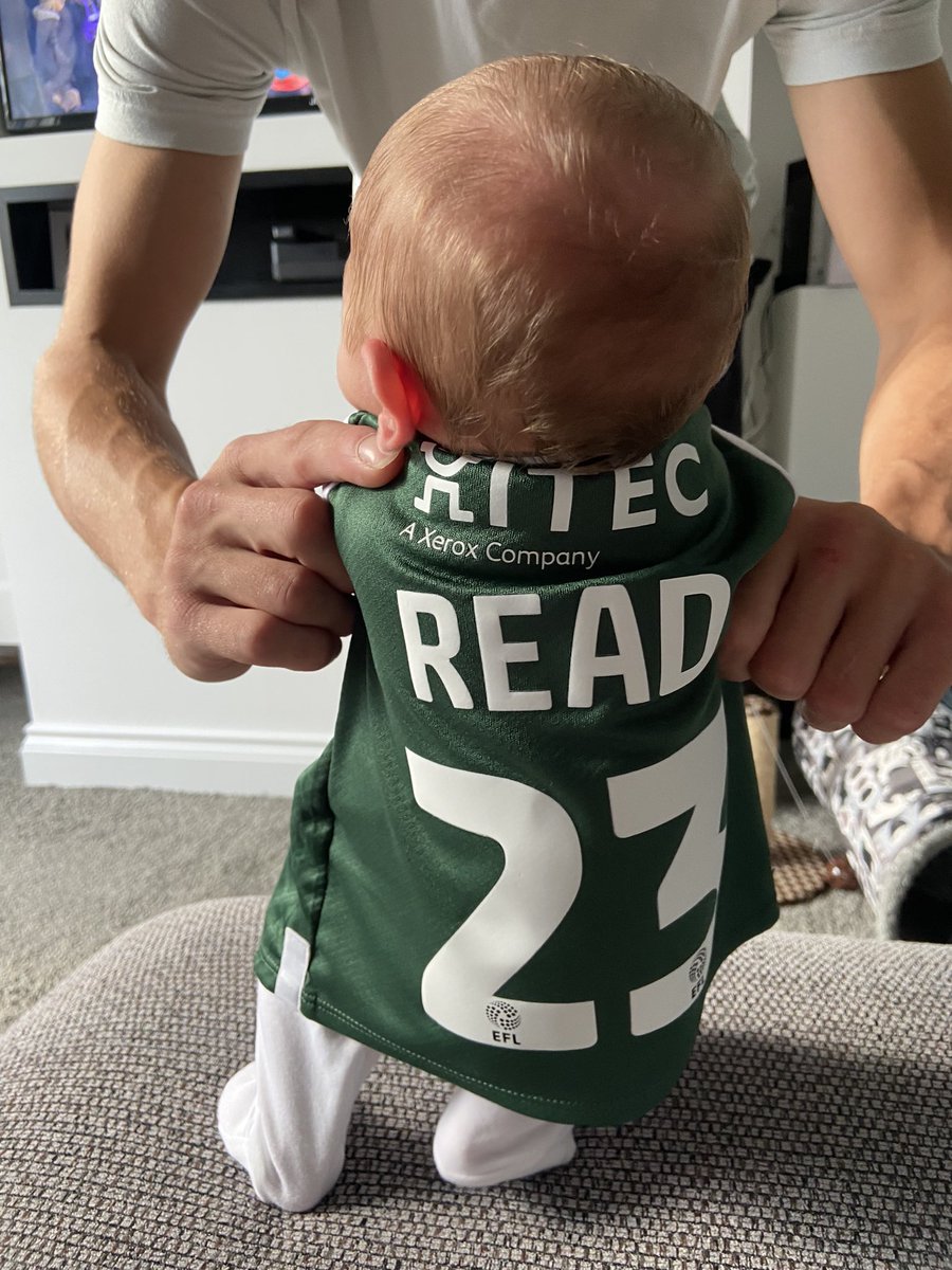 2 weeks old today and got to wear her <a href="/Argyle/">Plymouth Argyle FC</a> shirt we announced the pregnancy in whilst supporting the boys from home 🥹💚 #pafc