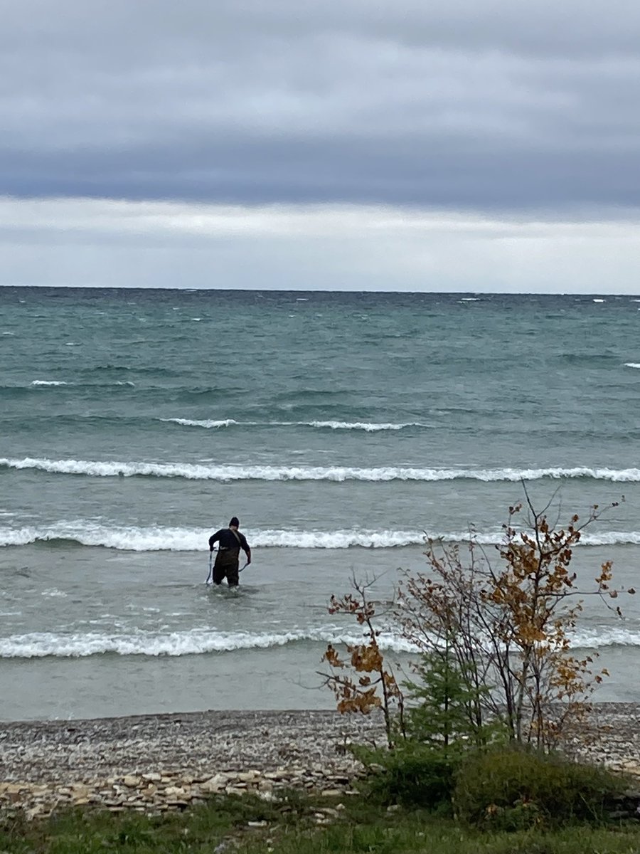 It’s cottage closing weekend. Here’s Mike wrestling with the waterlines in heavy waves and a North wind. Chilly!