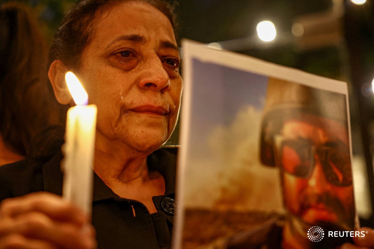 Yesterday: Aunt of Issam Abdallah, a Reuters video journalist who was killed in southern Lebanon while filming an Israeli tank firing into Lebanon, weeps during a candlelight vigil, in Beirut, Lebanon. Photo by <a href="/alfiky_amr/">Amr Alfiky | عمرو الفقي</a>