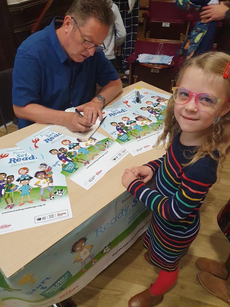MrsTWilkinson's tweet photo. At the event we had the pleasure of listening to author/poet @paulcooksonpoet perform and he also signed Ember's books she won and bought. Thank you @BoltonLMS it was a great event. @prestolee_1911 https://t.co/jXXy0TPXVJ