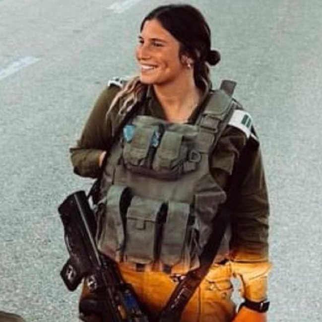 This is Captain Yuval, an infantry commander in the Nahal Brigade. On Saturday morning, as soon as she heard about the horrors taking place, she ran out of her home with her gun in her pajamas. She reports there were dead bodies all over the road, and that at some point, a