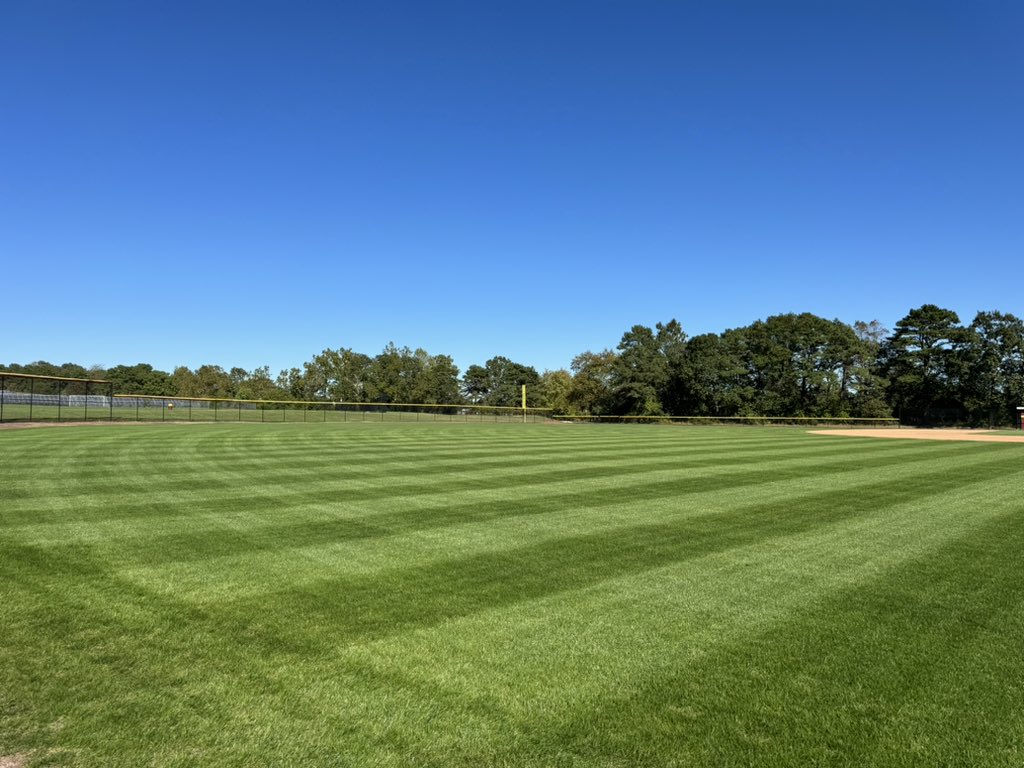 CRSDGrounds's tweet photo. Aerated, overseeded with a 50/50 rye/blue mix and top dressed with 90/10 sand/peat mix two weeks ago. This was the first cut, one day with a walker mower to collect the clippings and then a second cut with my striping mower.   Happy with the results so far. @puglisiBaseball https://t.co/LbLv0Zhhdf