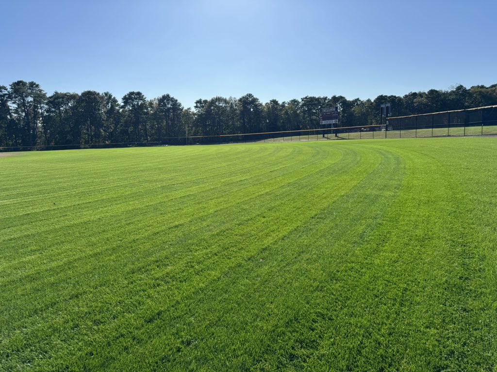 CRSDGrounds's tweet photo. Aerated, overseeded with a 50/50 rye/blue mix and top dressed with 90/10 sand/peat mix two weeks ago. This was the first cut, one day with a walker mower to collect the clippings and then a second cut with my striping mower.   Happy with the results so far. @puglisiBaseball https://t.co/LbLv0Zhhdf