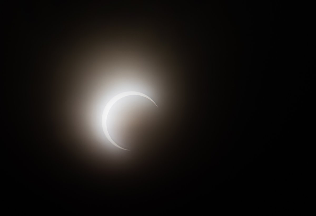 jonhouse_'s tweet image. This morning's eclipse over Portland through a few layers of clouds, and a pair of old sunglasses.