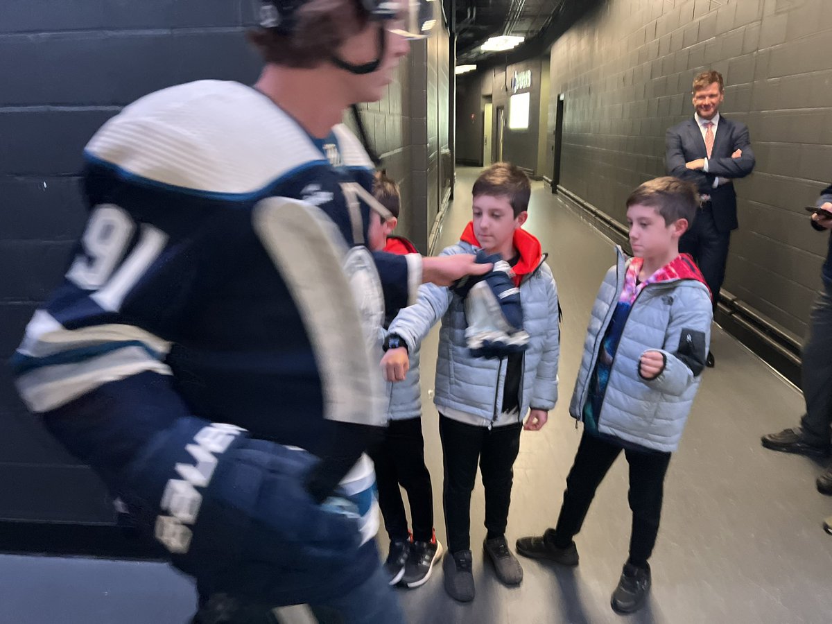 DMaetzMedia's tweet photo. What a night for the Tilden Triplets.  On their 9th birthday, these #CBJ fans get triple fist bumps from the Jackets. https://t.co/DummD06w2A