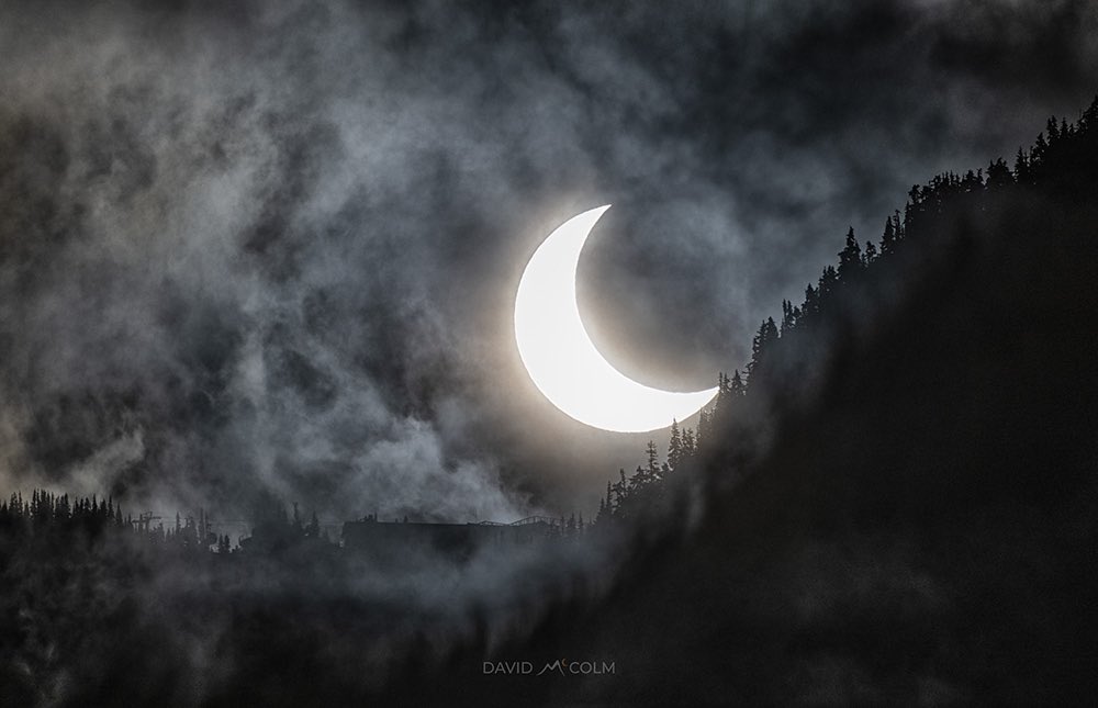davidlmccolm's tweet photo. What a great morning of eclipse chasing from Whistler, BC especially when the clouds parted right on ‘Q’ as the partially eclipsed sun over Whistler Mountain @GoWhistler @TamithaSkov #EclipseSolar https://t.co/oWxKxOJGp4