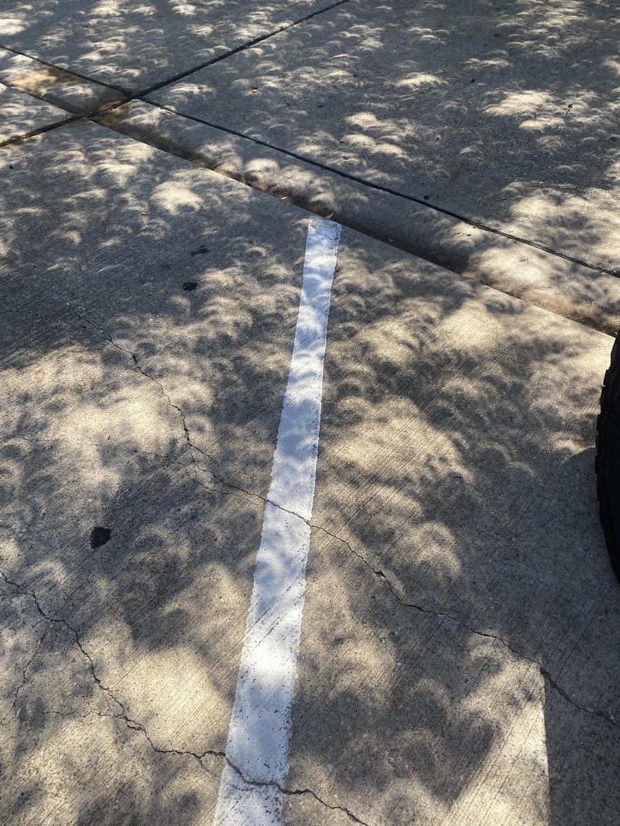 Watching eclipse from the tennis court- oooh those magic glasses and 3D leaf shadows!!