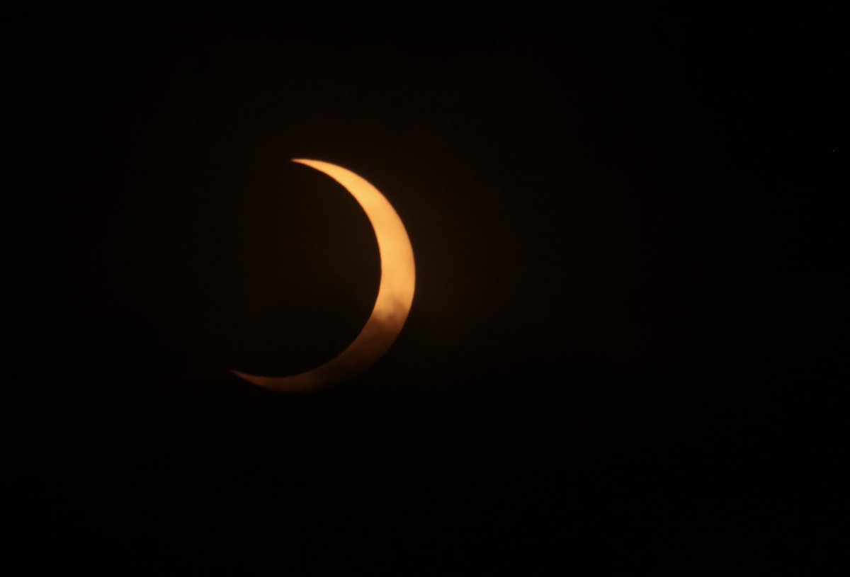 acmishra's tweet image. The sky started off cloudy, gradually becoming even more overcast.  Just when it seemed like the clouds would obscure the eclipse at its peak, they suddenly cleared.  This may be the billionth photo shared of the event, but the awe of such an incredible eclipse never diminishes.