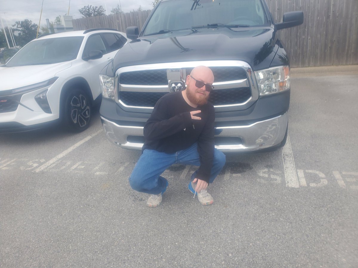 Pictured here is Brendan Scott, son of Darrell Scott, of Granby, MO. He's camera shy, but he's not truck shy! He just bought this 2017 Ram 1500 from me! Thanks, guys. I appreciate it. Visit McLarty Daniel Chevrolet and I'll help you, too.