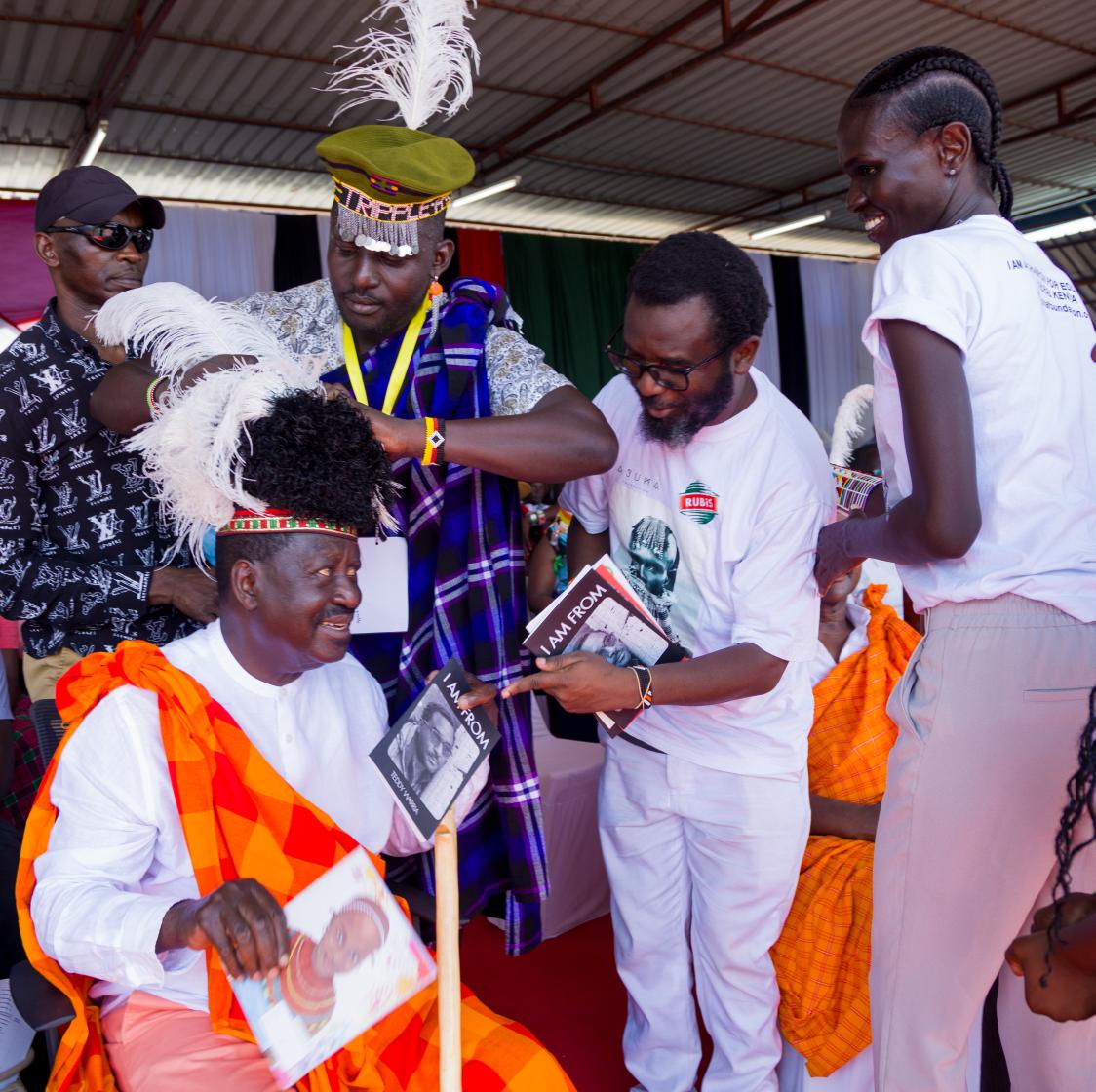 twarria's tweet photo. I AM.
I AM FROM.
A great pleasure to hand over my book, #IAMFROM, to the Rt. Hon. Raila Odinga at my 1st TOBOUNG'LORE at Ekalees Cultural Centre, Lodwar at the Cradle of Mankind. In my book, I have remembered my old friend, the late Dr. Richard Leakey, who had a wonderful plan to build and complete NGAREN - The Museum of Humankind ih Turkana - The Cradle of Humankind.
Raila has narrated his geneology numerous times and taken pride in it; and been deeply rooted in it. I pray that all Kenyans and its leaders would take pride in who they are as we all embrace the idea of being African. I look forward to the next Festival in Turkana where the folklore and riddles and traditional food will be the centre piece.
'Turkana Boy' one of our oldest fossils at the Nairobi National Museum should be brought and displayed at the Festival.
International Faces of Turkana like Ajuma Nasenyana should be front and centre. She has a remarkable Ajuma Exercise Book initiative, which has Faces of Kenyan ethnic groups that the young learners identify with. Kenya Tourist Board @magicalkenya lead us to knowing ourselves better, by going deeper in to who we are. I look forward to president @WilliamsRuto and Rt. Hon. Raila Odinga leading the nation in reciting their geneology and uniting Kenya in one national accord. We are the Africans we have been waiting for!
Dr. @KigoziMaggie @ALIEastAfrica PS @UmmiMBashir @EbosoAnne SC @MarthaKarua @ajumafoundation #AjumaExerciseBook @Africastalking #BuildWithAT