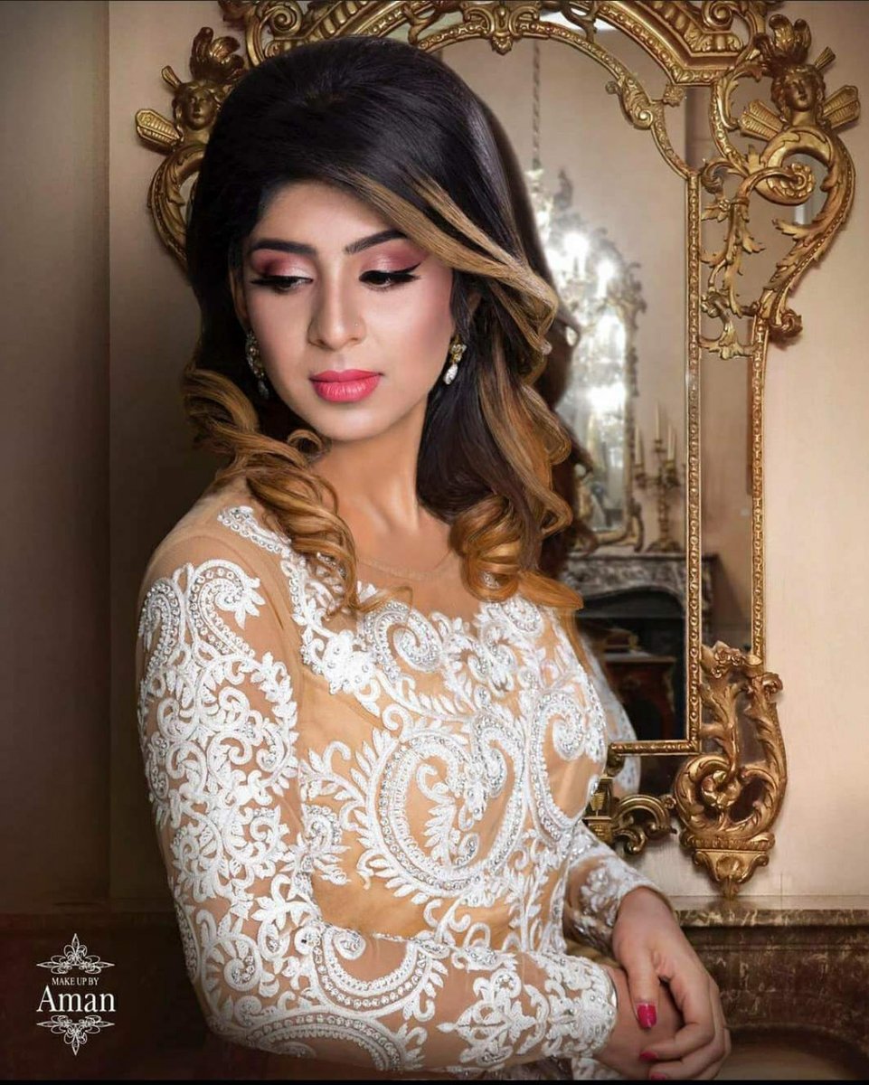 Shimmery pink tones on the eyes, thick winged liner and bright pink lips that coordinate with hot pink nails are a fresh modern twist on traditional Desi bridal glamour.

Bride styled by: <a href="/beautybyaman95/">Beautybyaman95</a>

ℹ️ Pro portfolio: makemebridal.co.uk/wedding-hair-a…