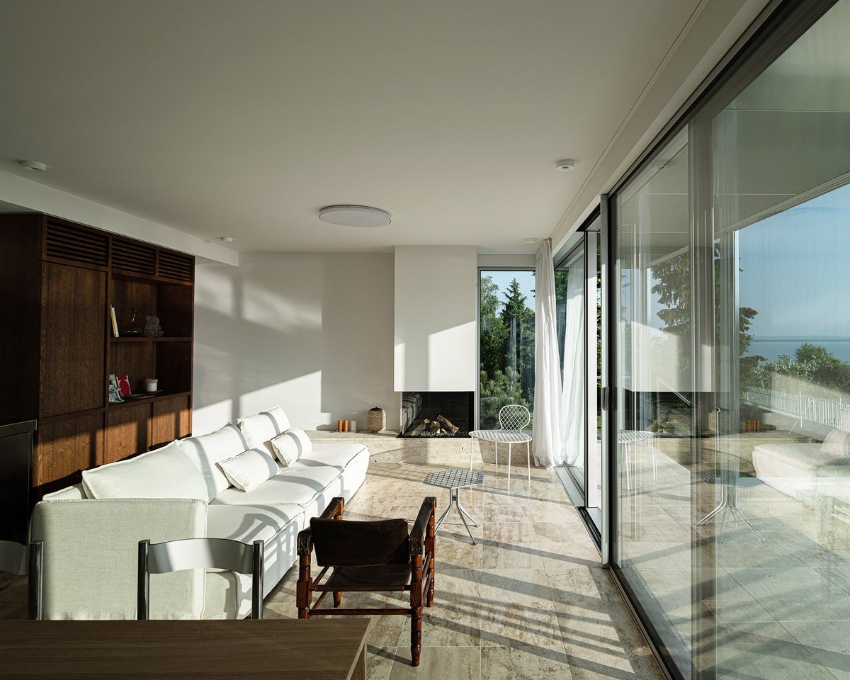 dezeen's tweet photo. A limestone plinth supports this Hungarian holiday home by Kontextus Architecture Studio: https://t.co/D13cH16qNT https://t.co/YUsOgx35jY