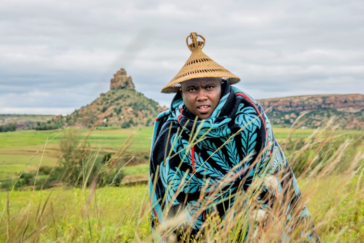 Enjoy your Sunday Friends. I am wearing my Mokorotlo hat which design is inspired by the conical Mount Qiloane behind me. I am also wearing Queen Victoria blanket (known in Sesotho as Lefitori).