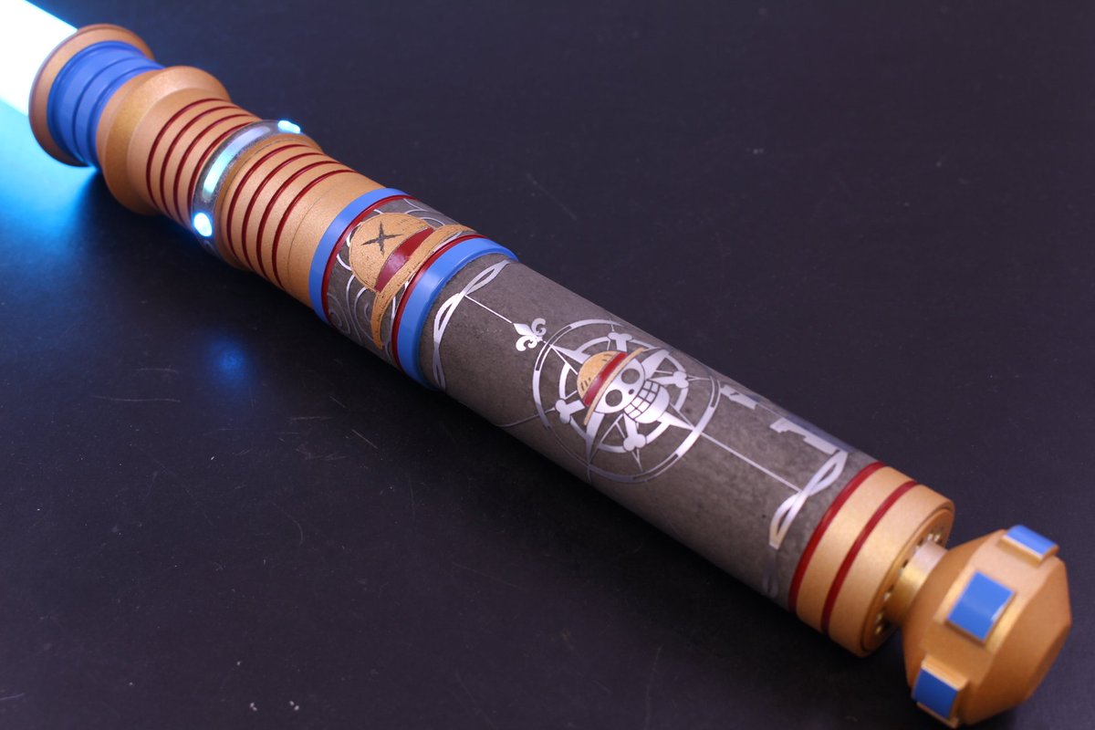 VadersVault's tweet photo. Vader's Vault at @NY_Comic_Con rocking a special @OnePieceAnime inspired custom lightsaber. Add this unique piece of functional art to your collection today at booth 1363 !!! 

Can't make the show? Check out some of our other lightsabers at https://t.co/100HCptCxE

#ONEPIECE #StarWars #lightsabers
