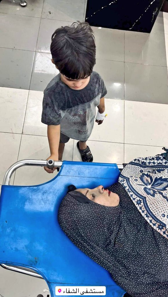 AhmedTawill's tweet photo. It’s Gaza where you can see this depressing scene, a poor kid standing helpless beside his heavily injured mother after Israeli bombing today in Gaza. Without appropriate health care supplies, medication or even electricity, she can’t make it.
#GazaUnderAttach #Gazagenocide #Gaza https://t.co/ulA7ZffLcT