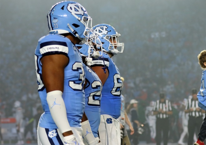 The coin toss last night for #UNC's game versus Miami Courtesy of our @kevinroy95