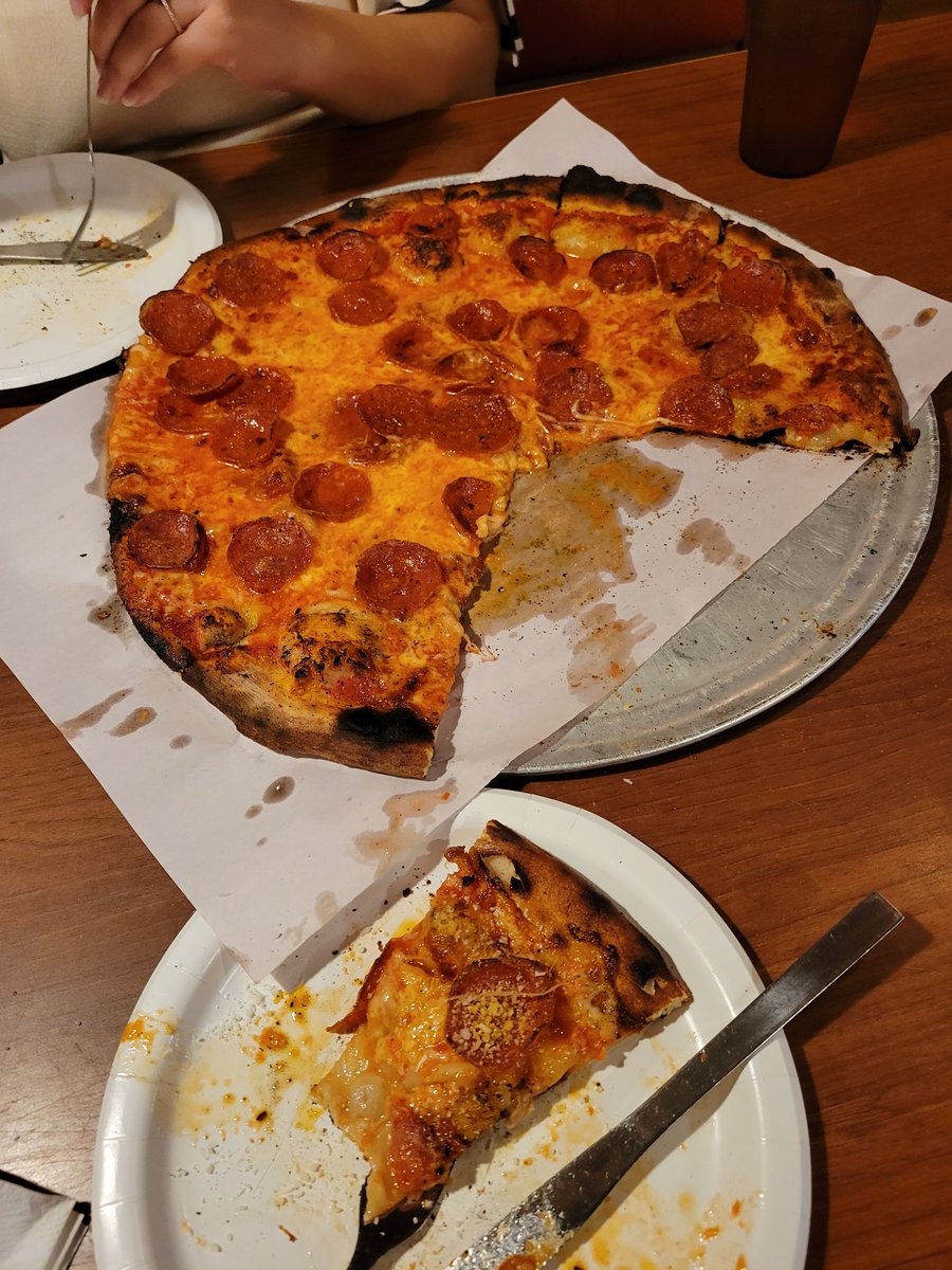 tommysec's tweet photo. New Haven pizza pilgrimage, stop No. 1: Modern Apizza. Great flavor, a little on the greasy side. Sprinkling parmesan helped. Nice amount of char, my fingertips were happily char-coated. https://t.co/bUjYOKHMAO