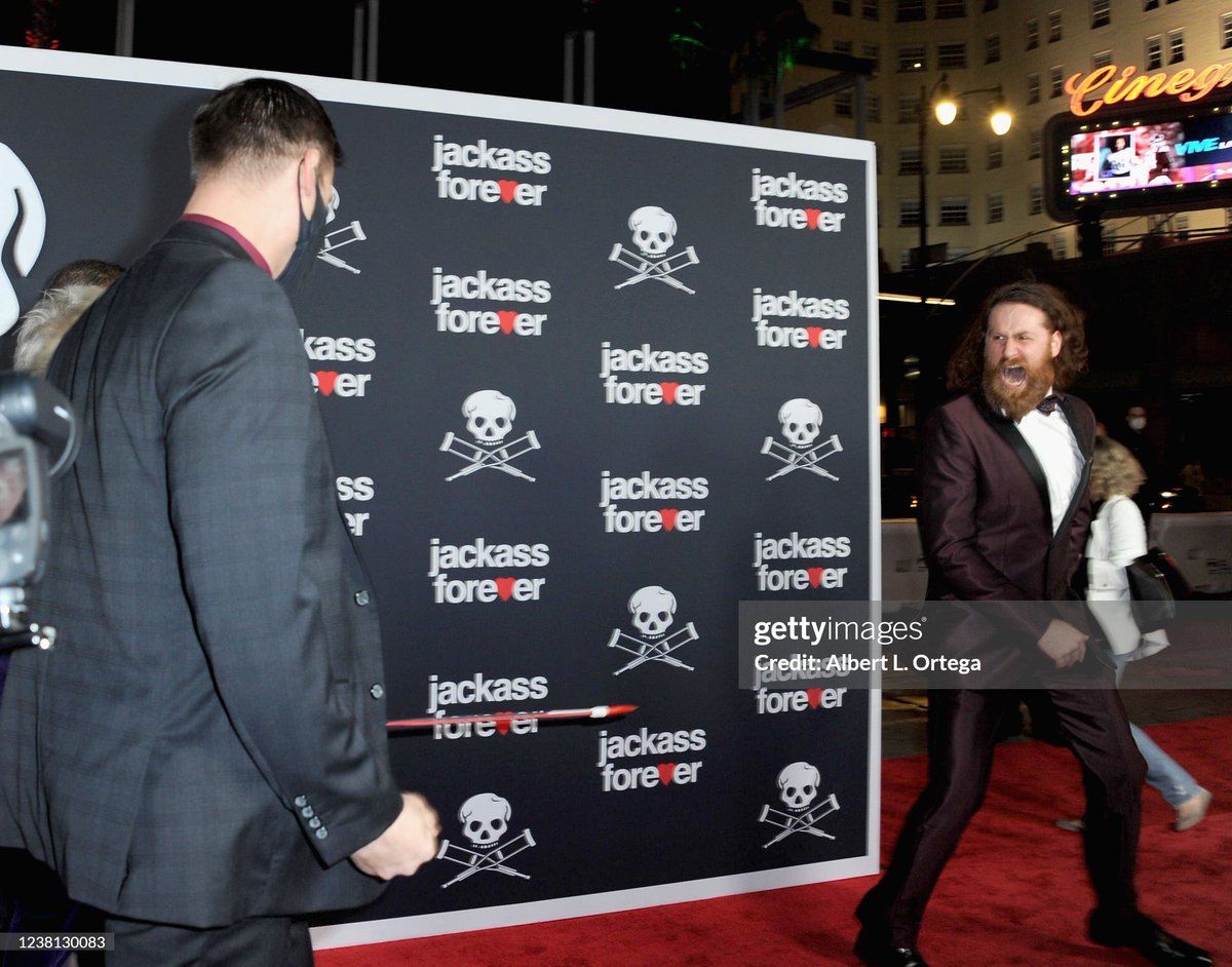 FightPromoting's tweet image. Sami Zayn is seen wearing a purple tuxedo outside TCL Chinese Theatre on February 01, 2022 for the U.S. premier of Jackass Forever