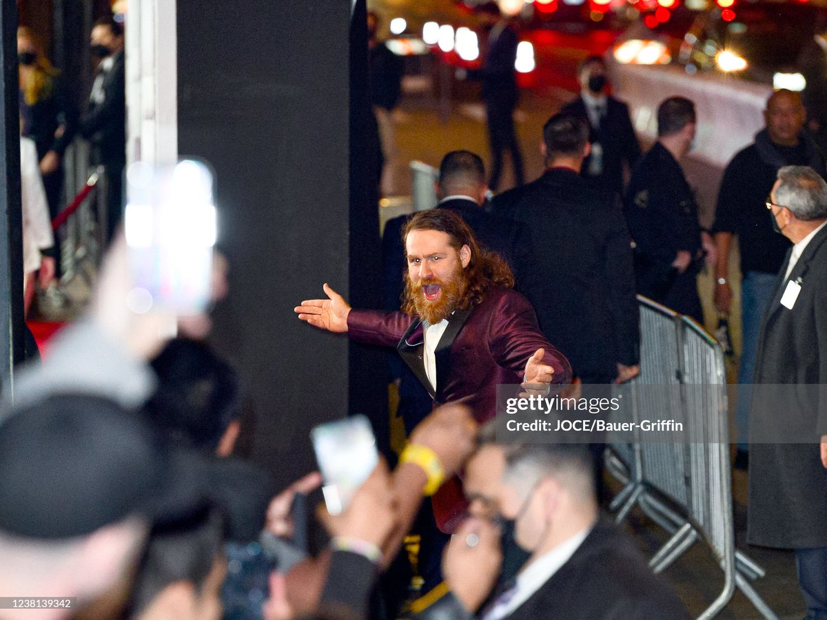 FightPromoting's tweet image. Sami Zayn is seen wearing a purple tuxedo outside TCL Chinese Theatre on February 01, 2022 for the U.S. premier of Jackass Forever