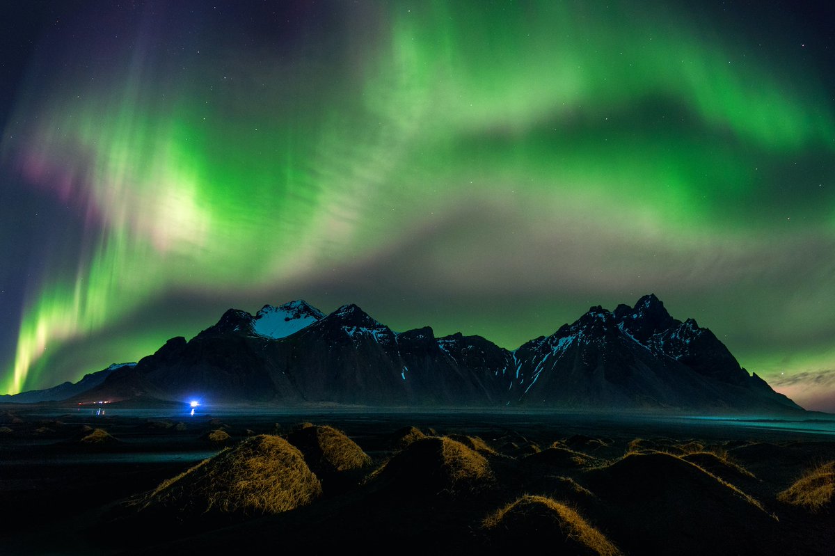 Dancing lights over East Iceland's rugged peaks – nature's most mesmerizing performance. ✨🌌