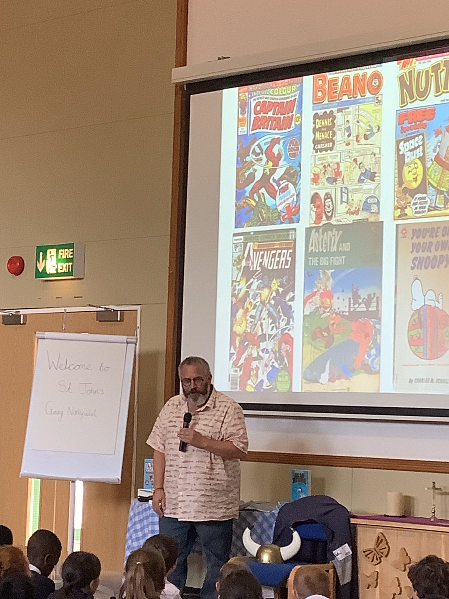 Primary_StJohns's tweet photo. Year 5 and 6 have enjoyed a fantastic time meeting the author and comic artist Gary Northfield. Thank you to @teacher_books for the inspiring history of an author who has created page popping history comics. #SJCReader https://t.co/x04fPiEmjI