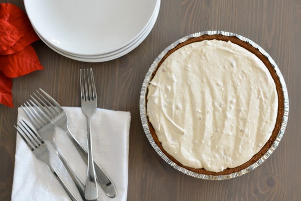 This quick and easy Frozen Peanut Butter Pie is perfect for holiday parties and great for potlucks! It's creamy and delicious and you won't believe how quick it is to make. cupcakesandcutlery.com/help-for-holid…