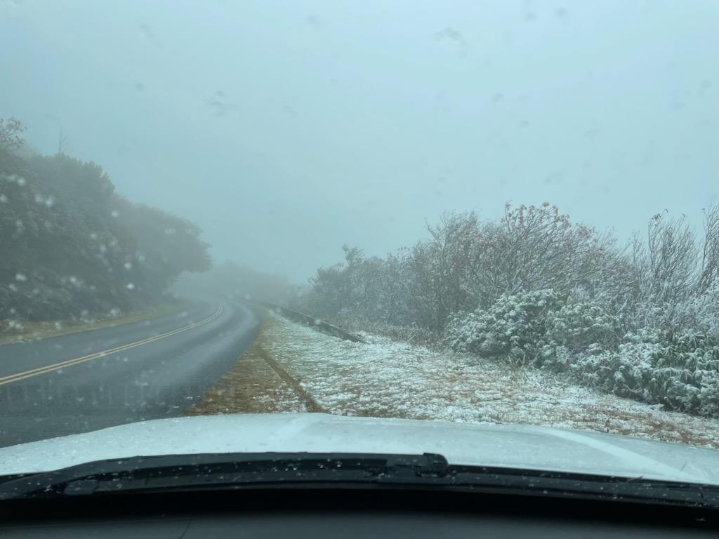 BlueRidgeNPS's tweet photo. As of 10/16 at 4:30p, mp 344 at Hwy 80 to mp 375 at Ox Creek Rd is CLOSED until staff confirm the road is safe for travel. 

NPS Image - First snowfall lightly covering the road, trees, and grass as seen from the interior of a car. https://t.co/X8Nq56SOD5