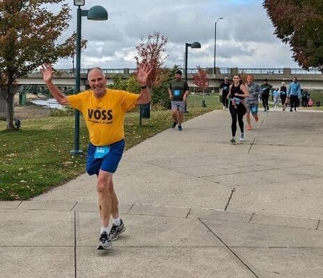 Perfect running morning yesterday for the Des Moines IMT Marathon events! I had a second-place 5k finish (31:14 chip time) in the 70-74 age-group. Craig Lein shot this snap at Principal Park less than a mile from the Court Avenue finish line.