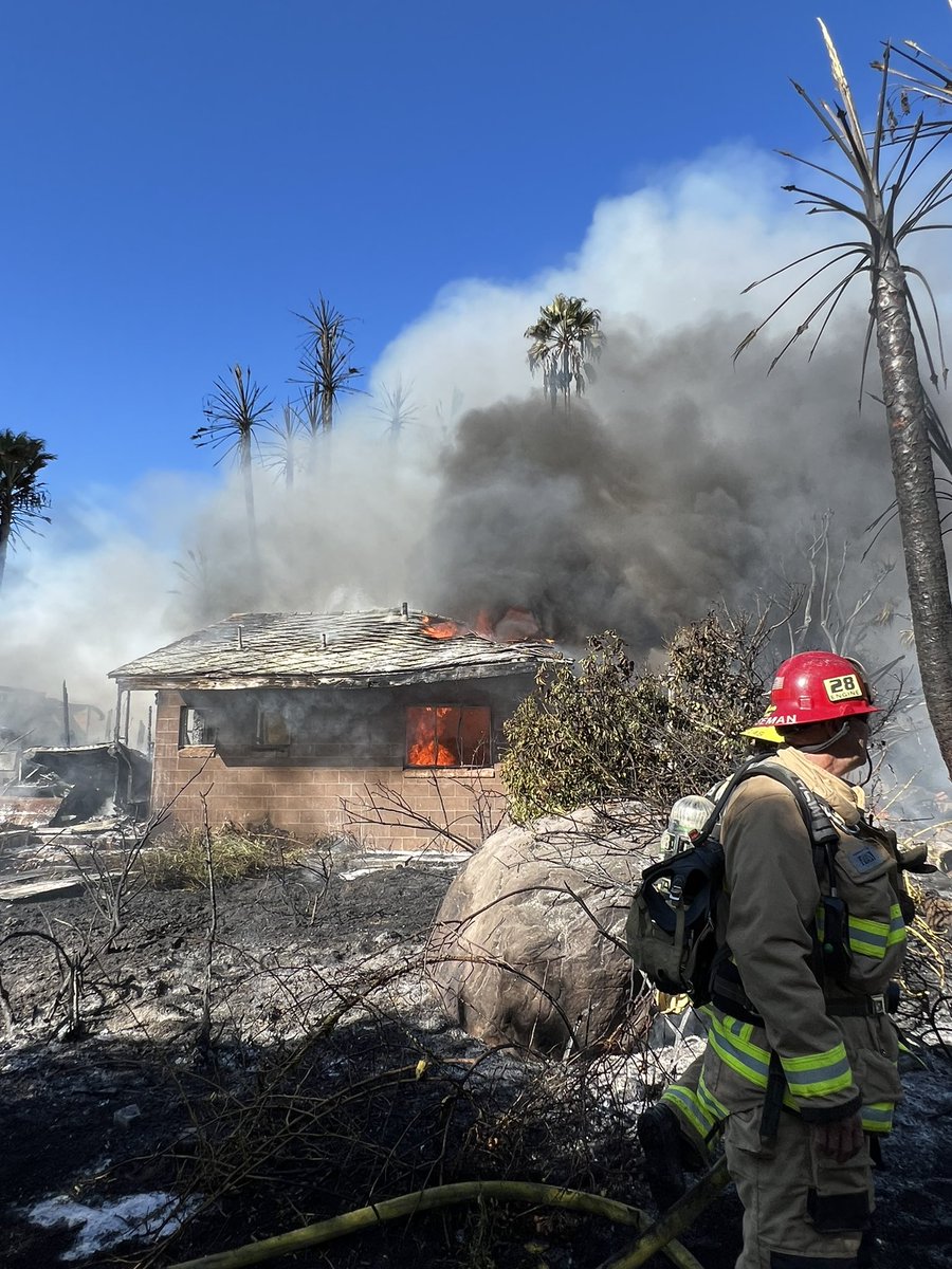 VCFD_PIO's tweet photo. #grandincident; FFs continue mop-up and overhaul on the structure fire off Grand Ave in Fillmore. FFs encountered a partial structural collapse early into the incident, and have been using defensive tactics to suppress the fire. https://t.co/wZKb0ybKGX