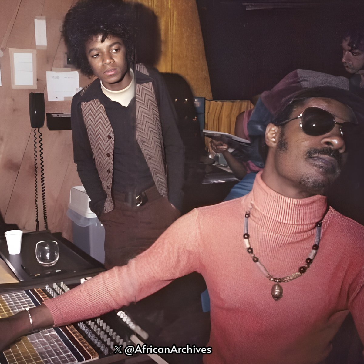 Michael Jackson in the studio with his cousin Stevie Wonder, 1975.
