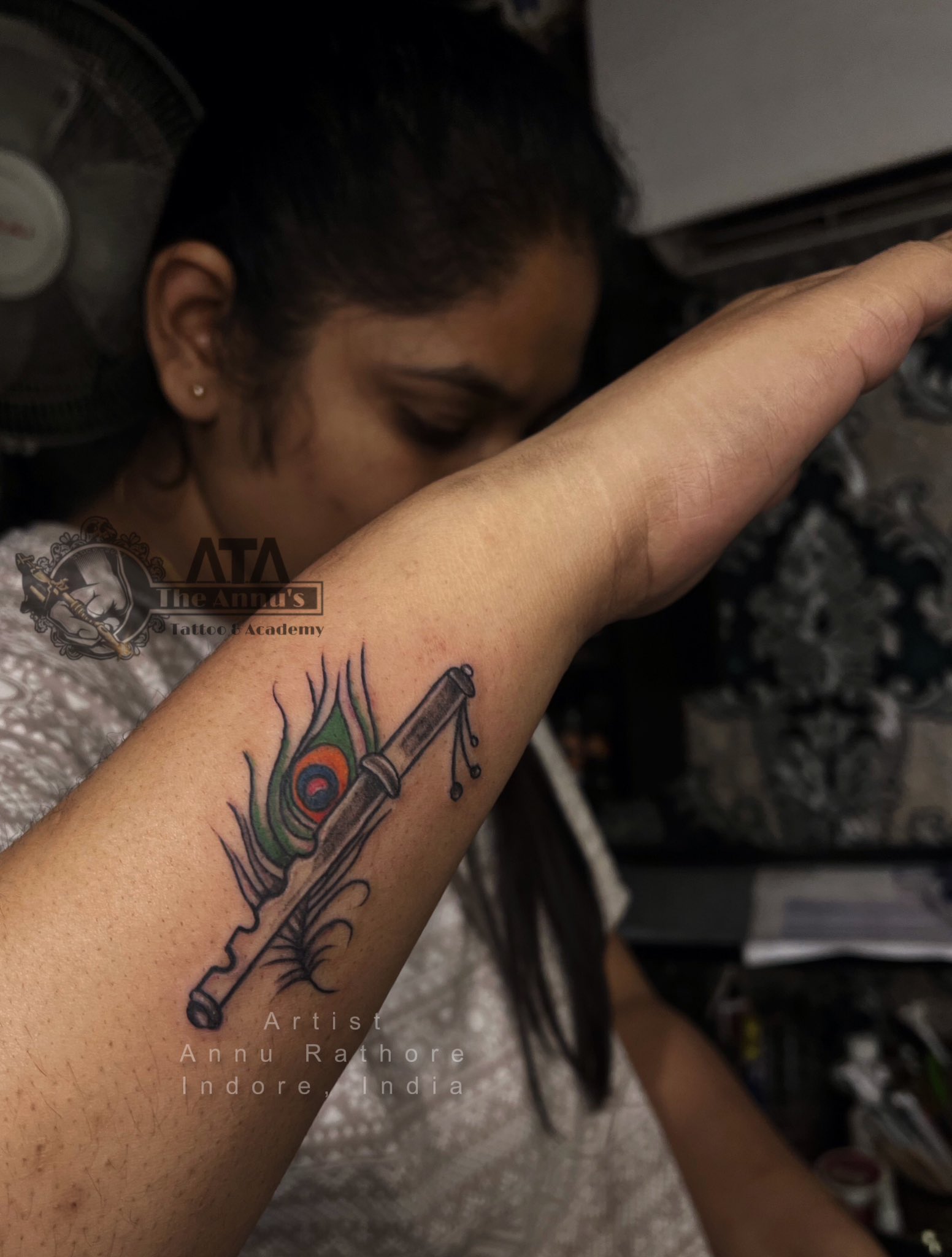 Peacock Feather With Flute Tattoo | Tattoo shop in ahmedabad, india | Flute  tattoo, Tattoos, Peacock feather tattoo
