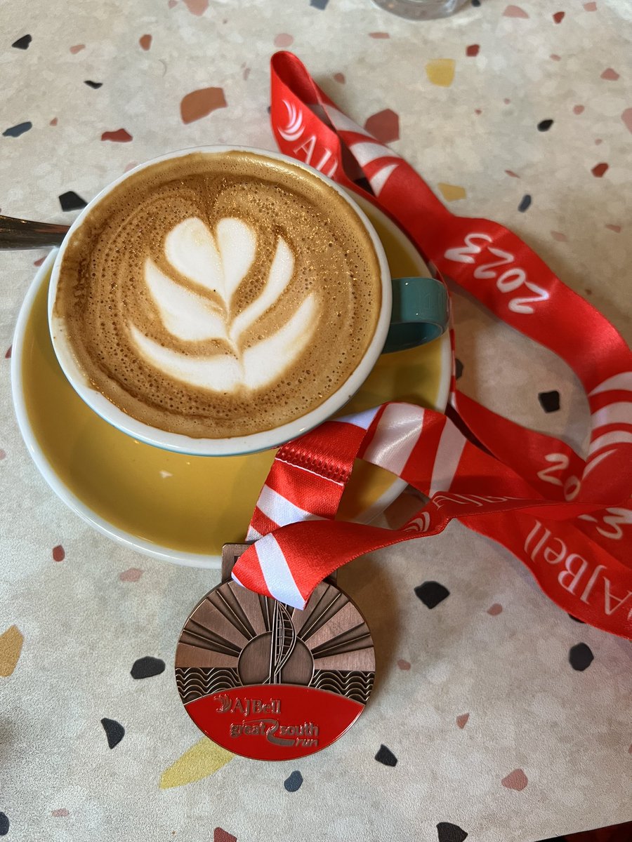 jumpylegs's tweet photo. Slightly late for #MedalMonday but hereโs my #greatsouthrun medal with an excellent & much needed post race coffee. Thanks to @LifeatAJBell for their race support. Brilliant event. #feelgoodrunning https://t.co/5CSxu16Mg1