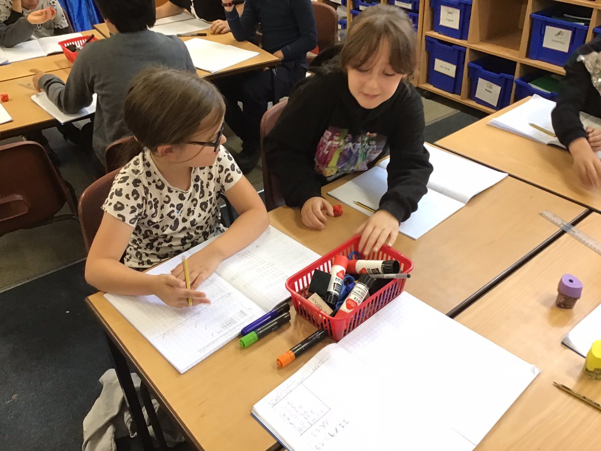 ClaphamTerrace1's tweet photo. Year 4 are adding Roman numerals! It is a challenge but everyone is being so resilient. We are working collaboratively with our maths partner to roll dice to find out our tens and ones and then adding them together in Roman numerals. #workinghard #resillient #challengingmaths https://t.co/puiDT3GCkO