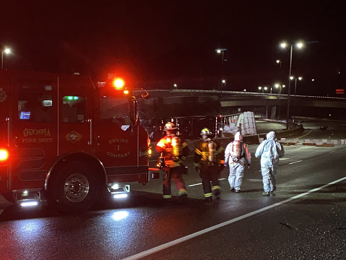 wspd1pio's tweet photo. NB and SB I-5 in Olympia remain closed for this incident. Traffic is being detoured to SR-101 in both directions. WA Dept of Ecology on scene assessing for HAZMAT concerns involving corrosive substances that were a part of the load. @OlyFireDept @EcologyWA @wsdot_tacoma -DS https://t.co/Ib6vEqTWFY