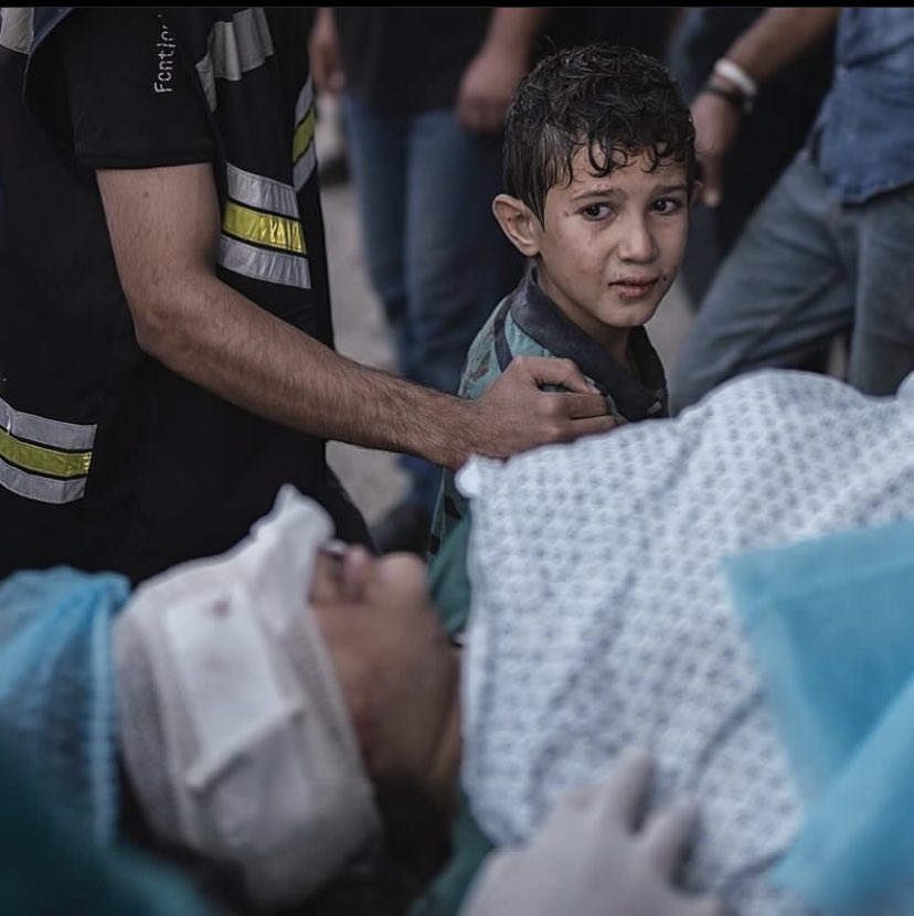 A Palestinian child whose dream was to live like other children an innocent life in the arms of his father. Yesterday, the Zionist and criminal war machine bombed his house and killed his family and only he survived. This innocent child, whose innocence was taken away, will grow