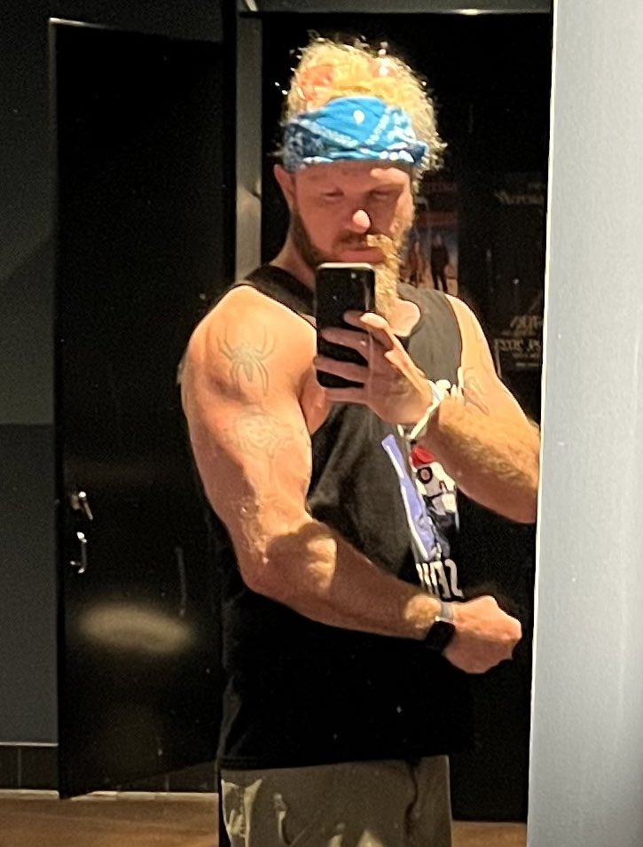 TheBoozerweight's tweet photo. Sometimes your hair is crazy and you forget your pink aviators are tangled up in it, but the venue’s bathroom lighting is too good not to take a mirror pic. #Boozerweight #BodyGuy #BionicBoozerweight https://t.co/IcBCCjkR1U